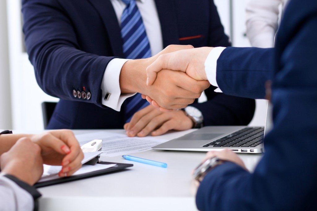 Business handshake at meeting or negotiation in the office