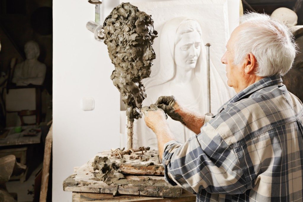 Artist creating a sculpture