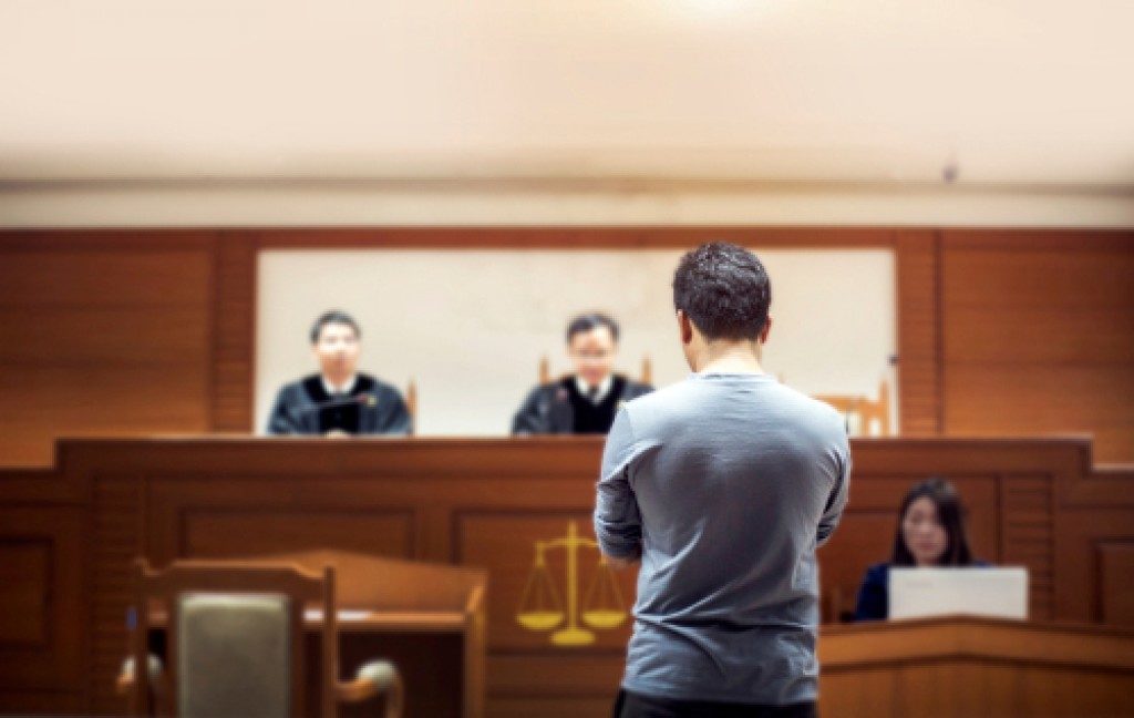 witness standing in a court room