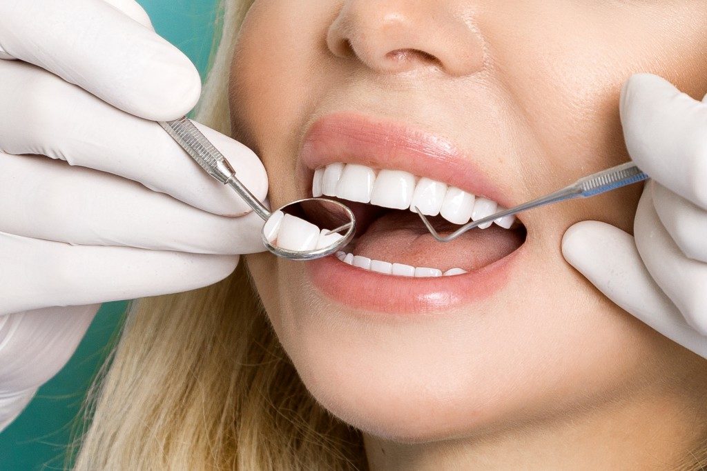 getting teeth checked by dentist