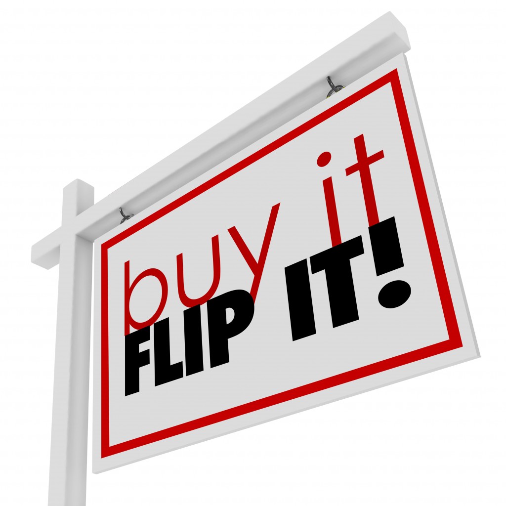 Buy It Flip It words on a 3d real estate home or house for sale sign to illustrate investing in a fixer upper property, improving and reselling it