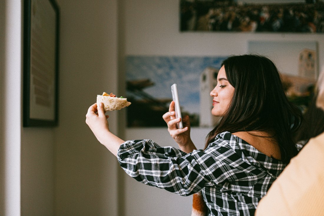 influencer taking photo of food