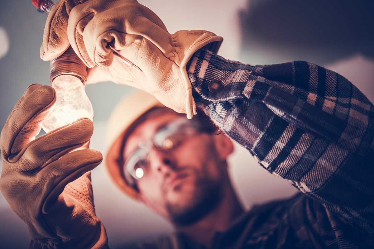 man changing the light bulb