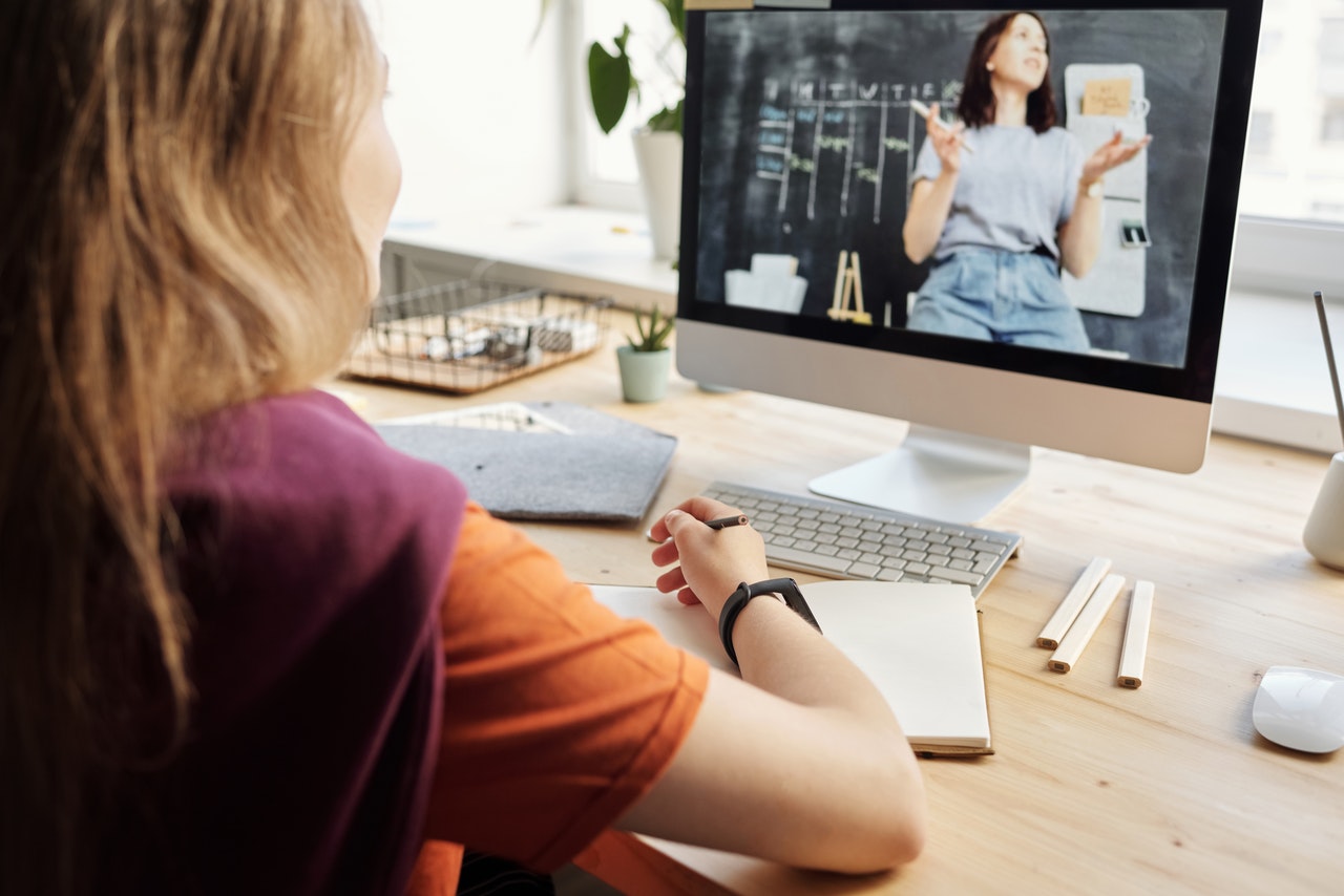 young girl attending online classes