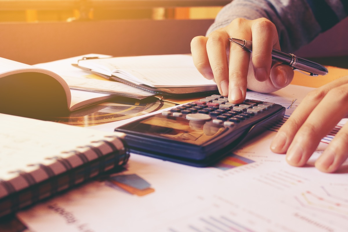 man using a calculator