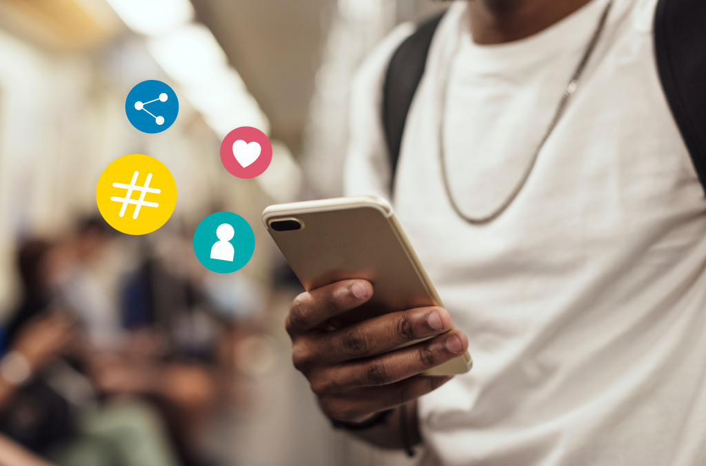 person accessing social media on his mobile phone