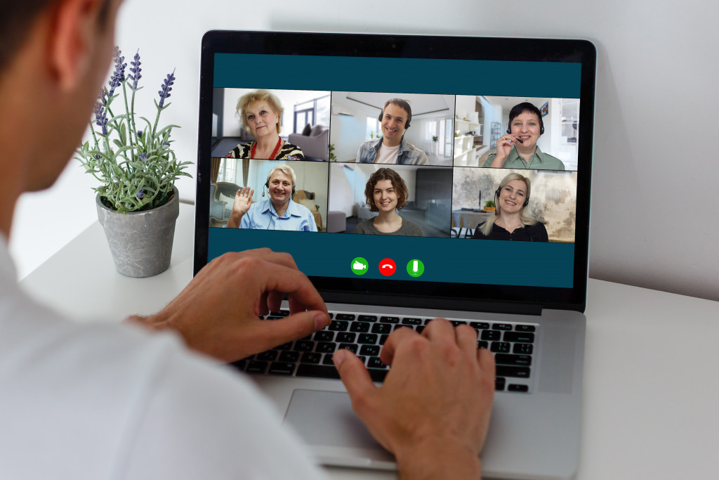 Online business meeting. On the laptop screen, people who gathered in a video conference