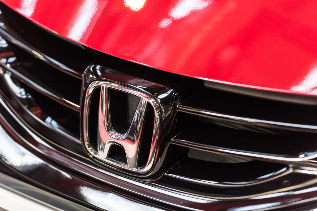 Closeup of the logo of a Honda car