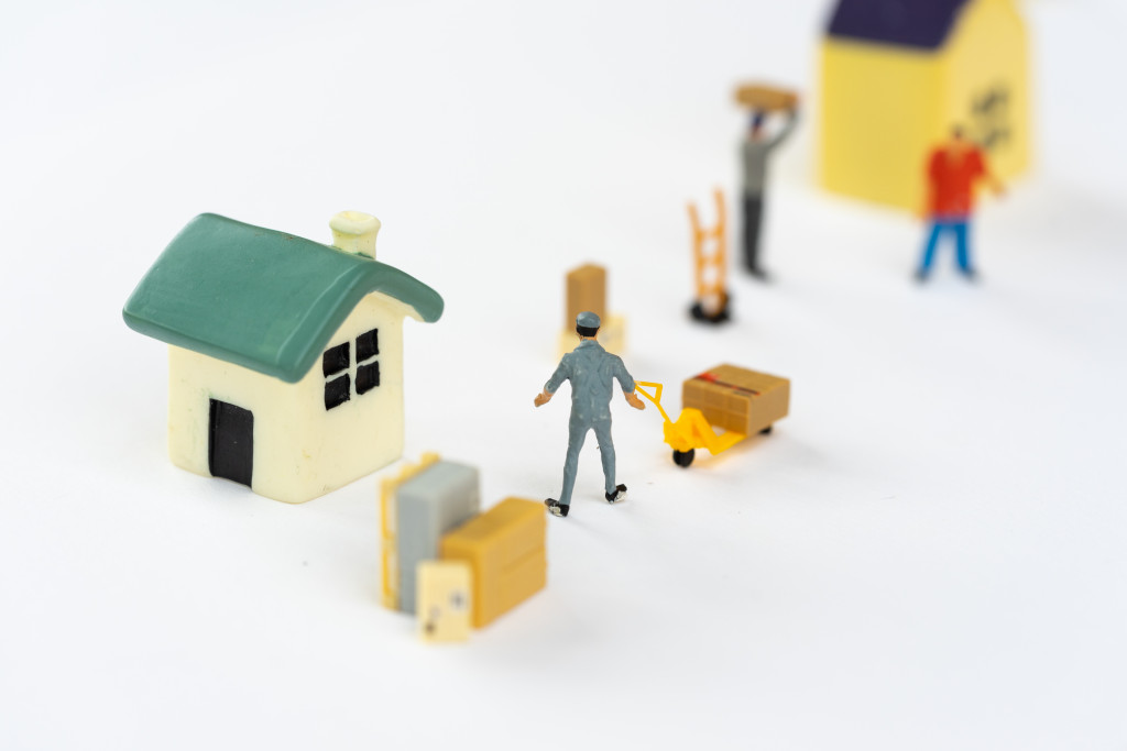 a miniature art with people and houses