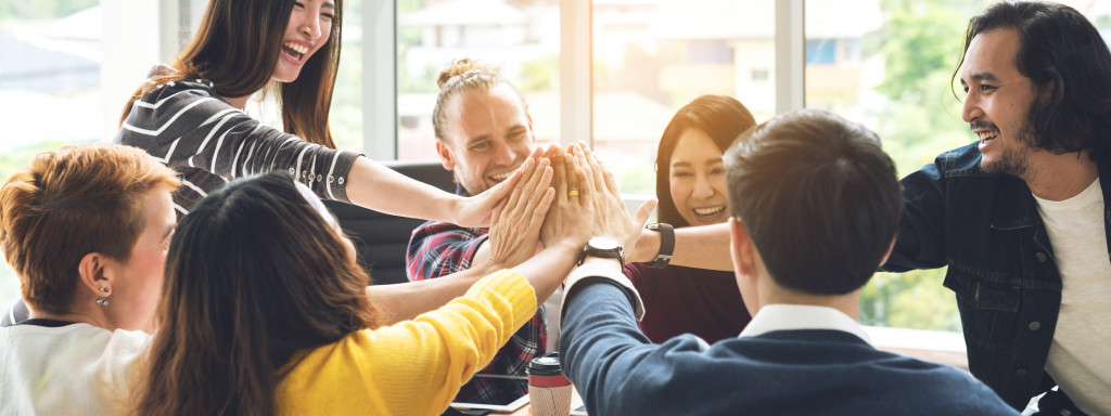 employees doing high five