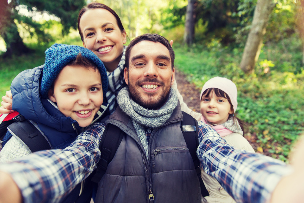 family taking a selfie on a hike