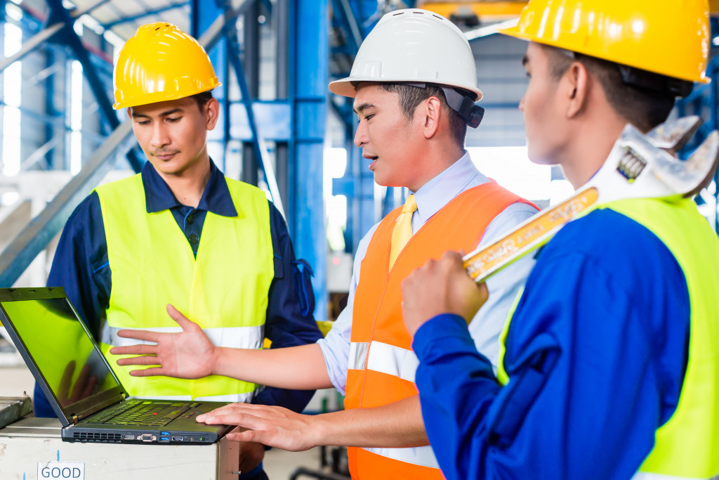 men wearing construction safety gear