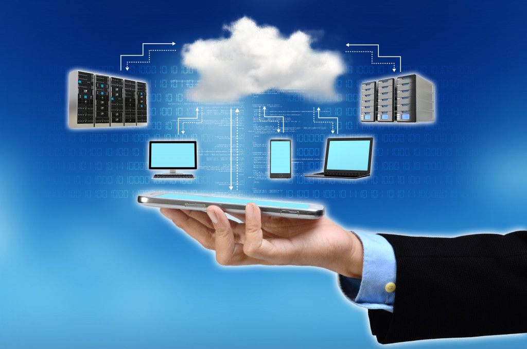 businessman utilizing database and cloud computing